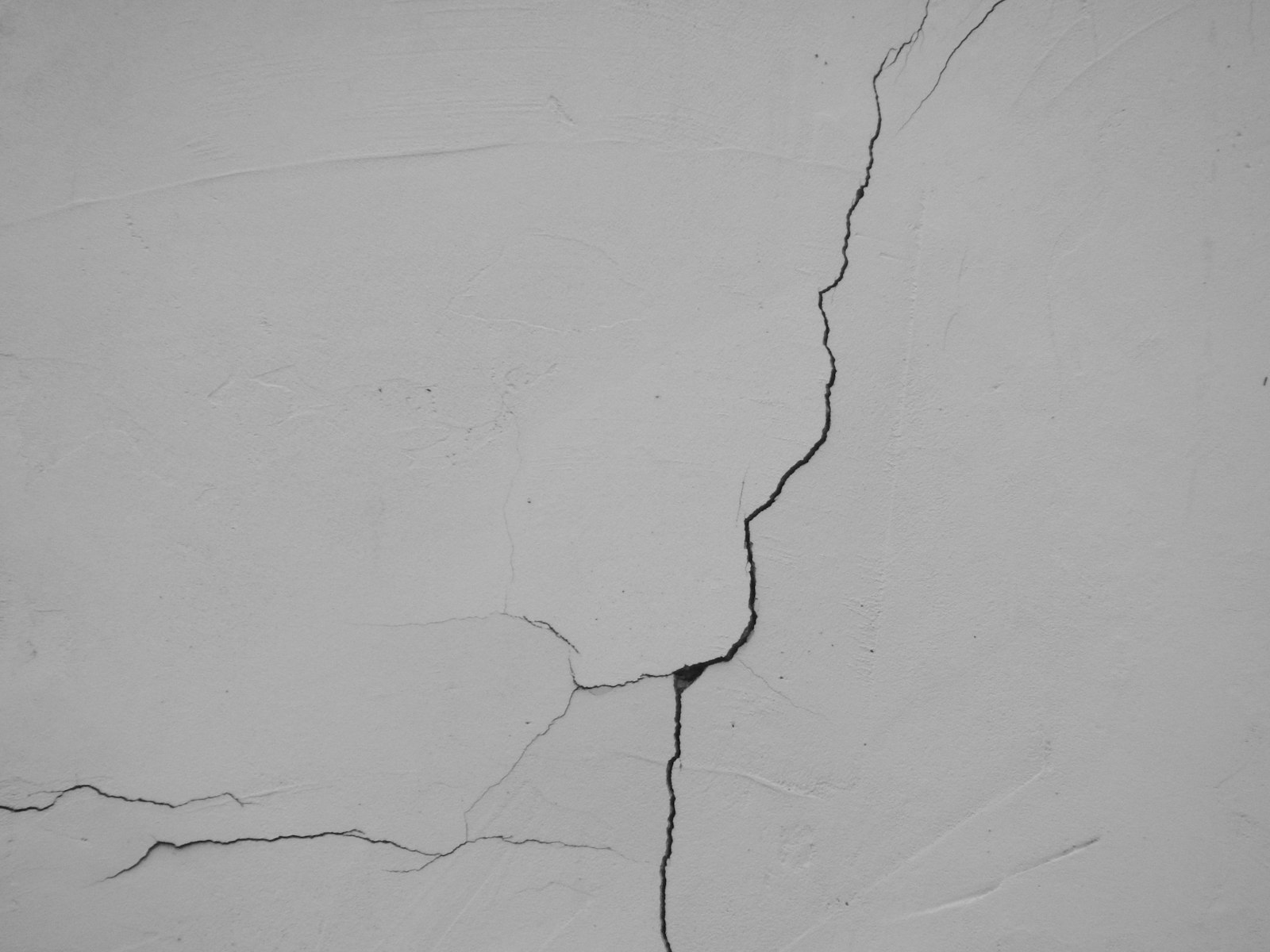 A crack running along a white wall